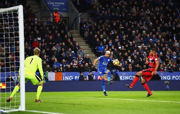 Riyad Mahrez of Leicester City scores the opening goal during the Premier League match between Leicester City and Huddersfield Town at The King Power Stadium on January 1, 2018 in Leicester, England. (Dec. 31, 2017 - Source: Clive Mason/Getty Images Europe)